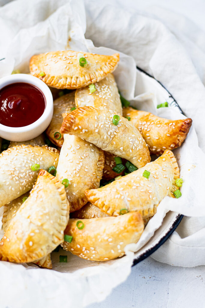 Tuna puffs in a bowl with dipping sauce