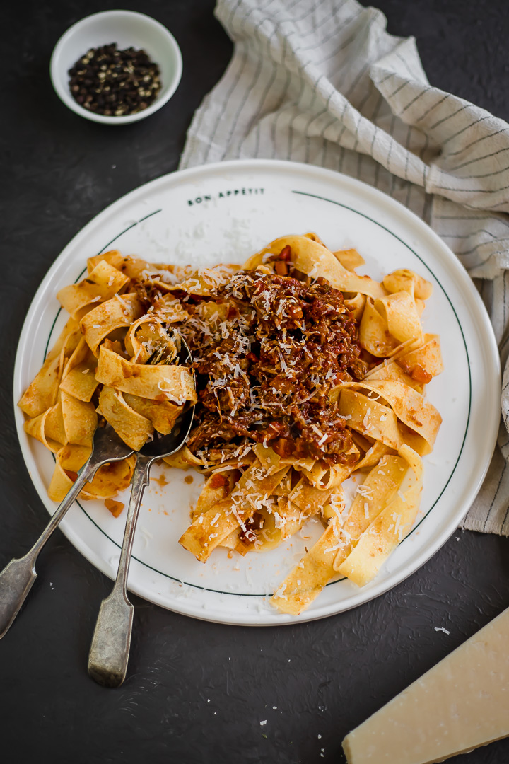 A plate of beef short rib ragu with pappardelle