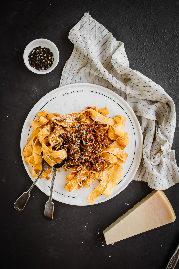 A plate of beef short rib ragu with pappardelle