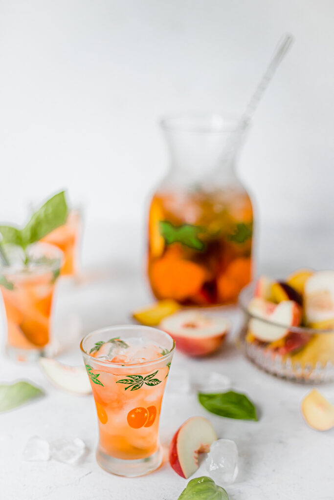 Small glasses of peach aperol punch