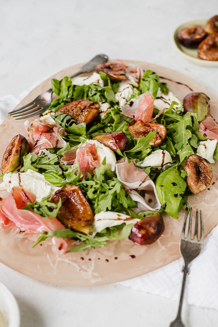 Close up of figs, mozzarella and prosciutto salad