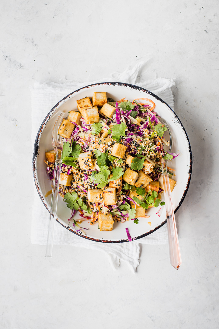 Crispy tofu on a bed of slaw with satay dressing