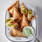 A tray of samosa toasted sandwiches