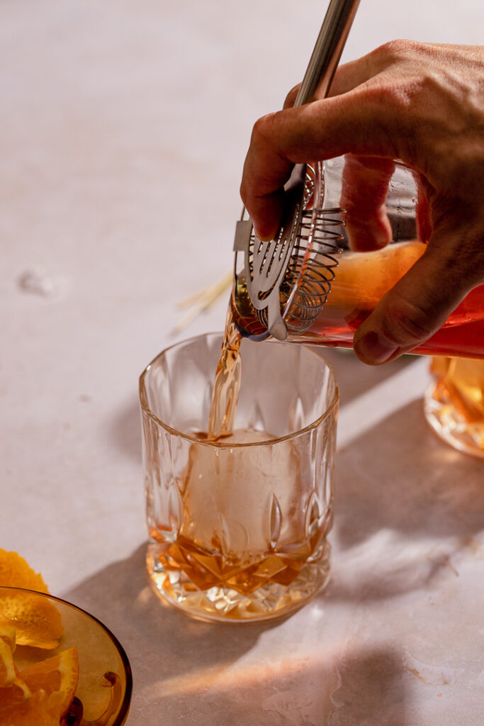 Pouring cinnamon old fashioned