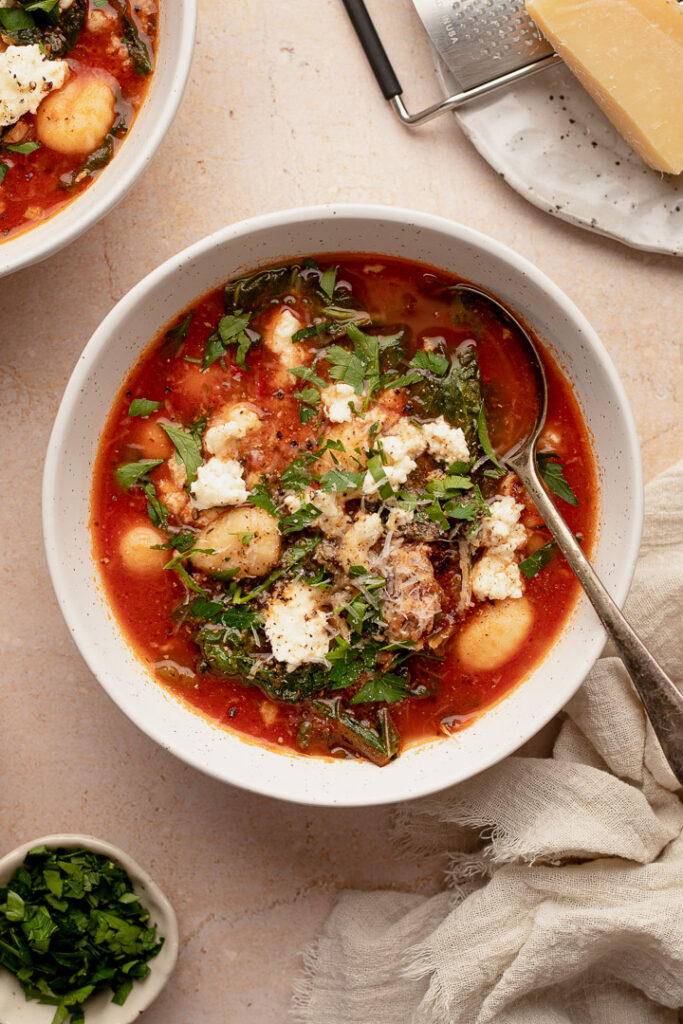A bowl of gnocchi, italian sausage soup