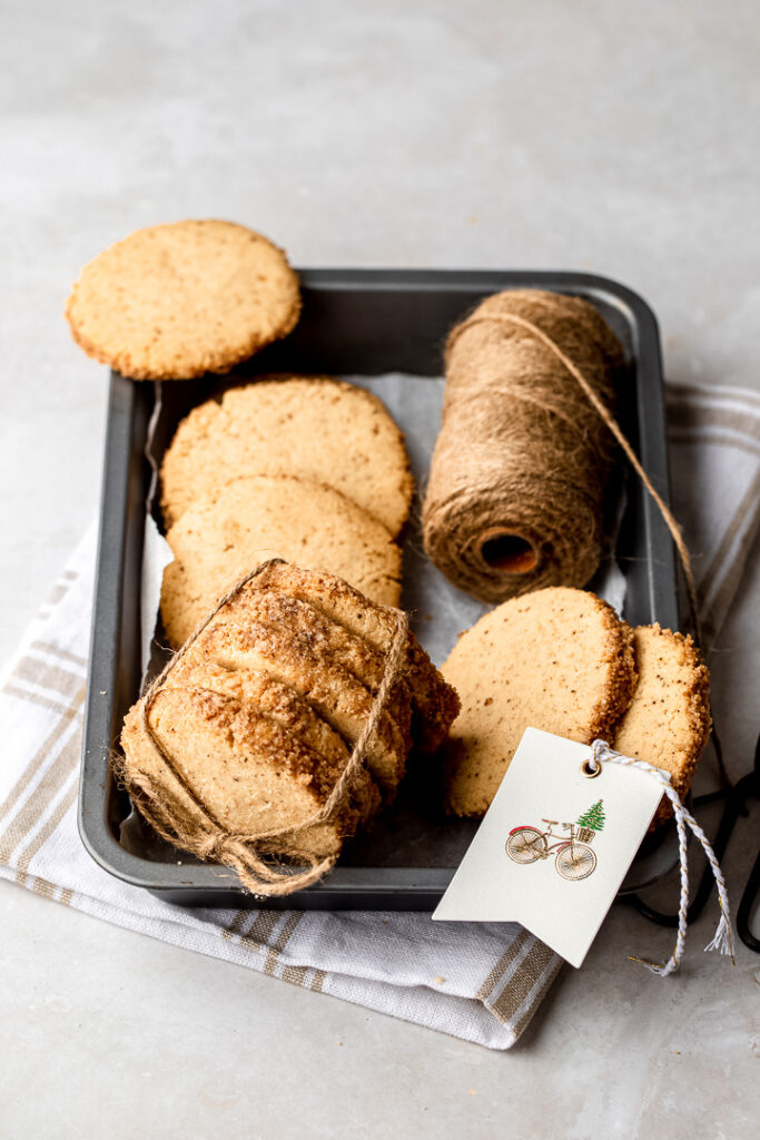A tray with brown butter cinnamon short bread, twine and a Christmas tag.