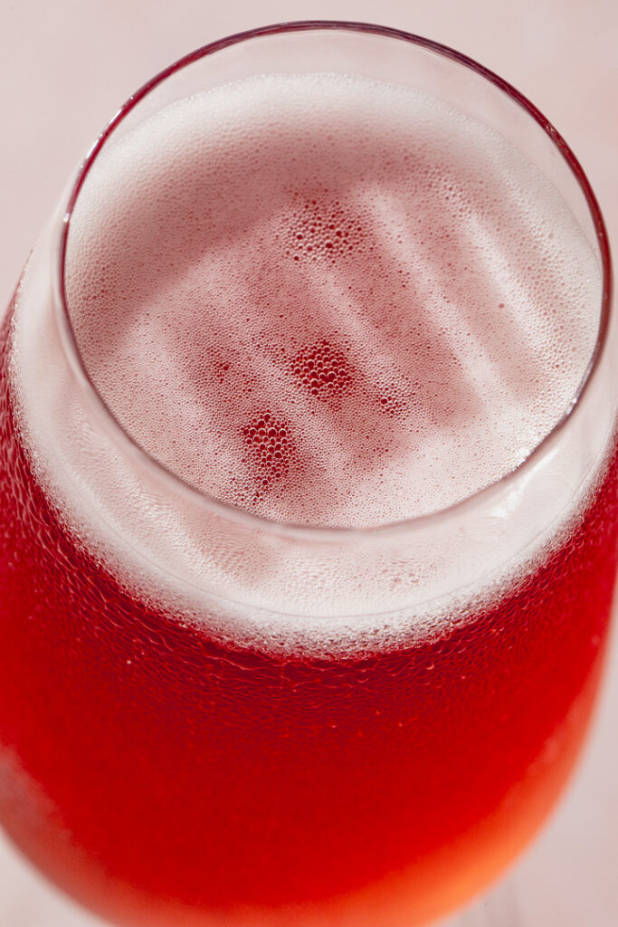 A close up shot of the bubbles atop of a Kir Royale