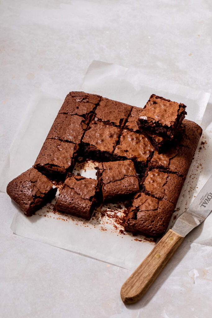 A slab of chocolate brownies cut into squares