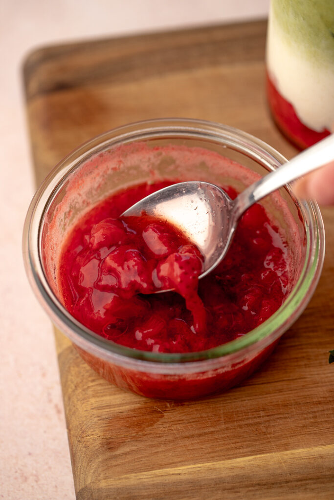 Close up of a jar of strawberry compote.