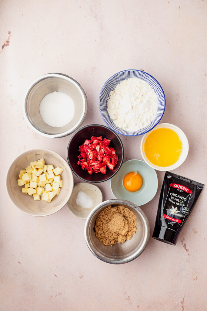 Ingredients in bowls laid out for strawberry and white chocolate cookie for two